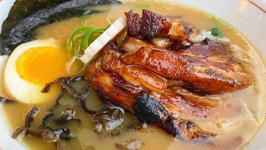 Tonkotsu Ramen · Thin noodles in the pork broth pork chashu, scallions, kikurage mushrooms, bamboo shoots, egg, fish cake, and nori.