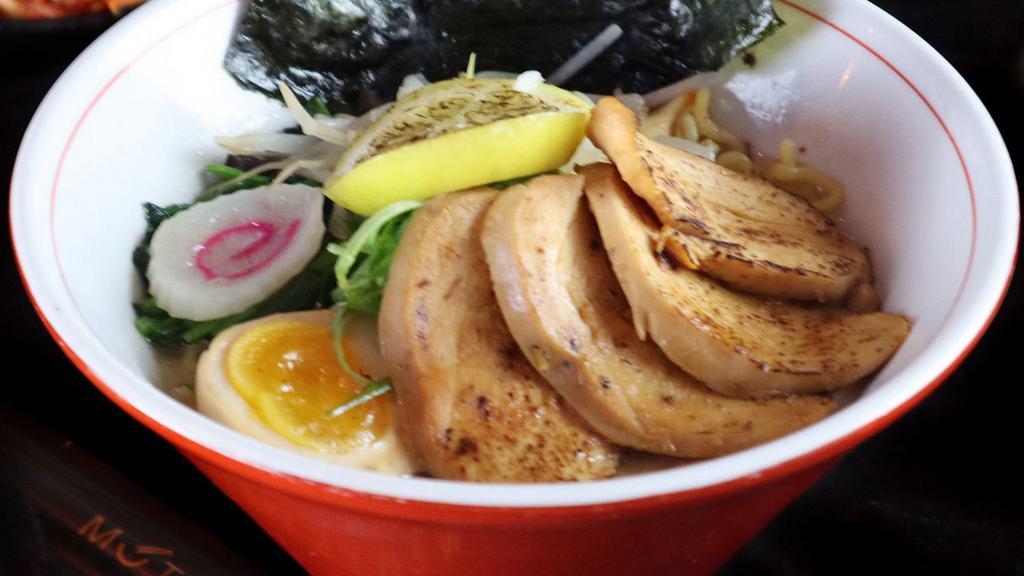 Yuzu Shio Ramen · Thin noodle in the chicken broth, chicken chashu, spinach, scallion, beans sprouts, grilled lemon, fish cake, seasoned egg, nori.