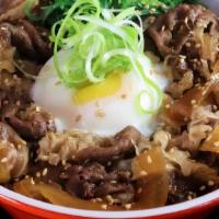 Sukiyaki Don · Marinated and thinly sliced beef brisket cooked with onions served over rice, topped with po...