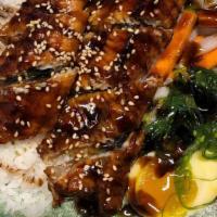 Unagi Don · eel, served over rice with seasoned egg, pickled , seaweed salad, spinach , scallions.