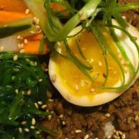Braised Minced Pork Don · Braised minced pork, served over rice with seasoned egg, pickled, seaweed salad, spinach, sc...