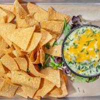 Spinach And Artichoke Dip · House-made fresh spinach and artichoke dip served with fresh tortilla chips.