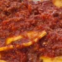 Ravioli With Meat Sauce · Cheese-filled ravioli with our savory meat sauce