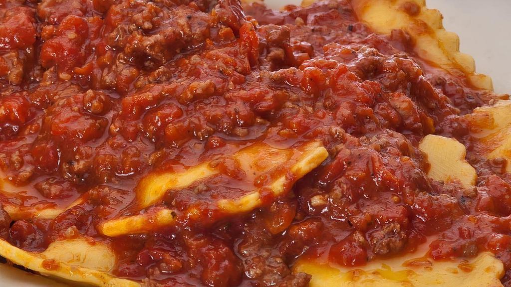 Ravioli With Meat Sauce · Cheese-filled ravioli with our savory meat sauce
