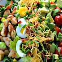 Cobb Salad · Grilled Chicken, Avocado, Bacon, Grape Tomatoes & Hard-Boiled egg over Mixed greens.