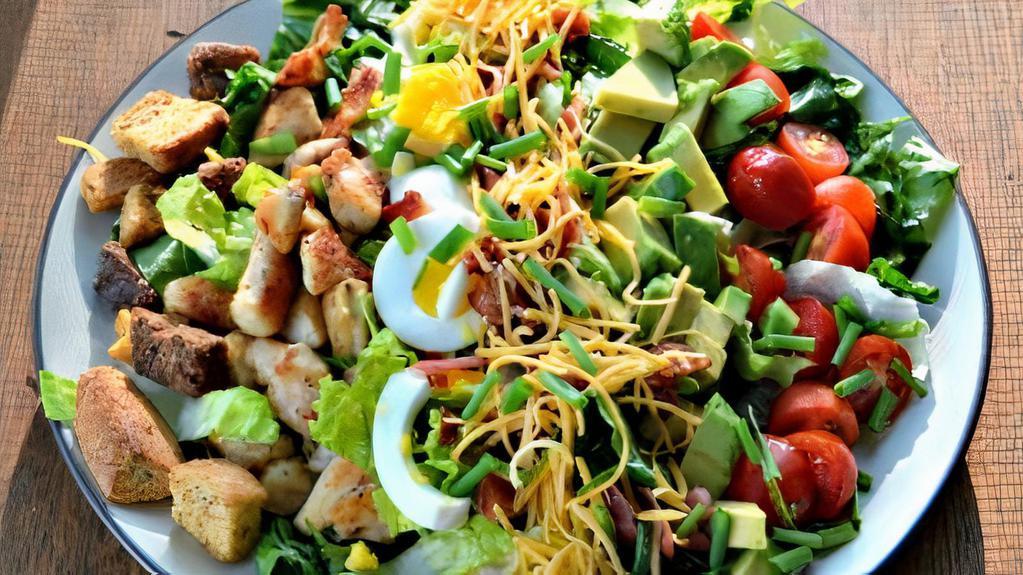 Cobb Salad · Grilled Chicken, Avocado, Bacon, Grape Tomatoes & Hard-Boiled egg over Mixed greens.