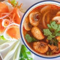Tom Yum Soup · Shrimp with mushroom, onion, galangal, lemongrass, lime leaves and chili paste.