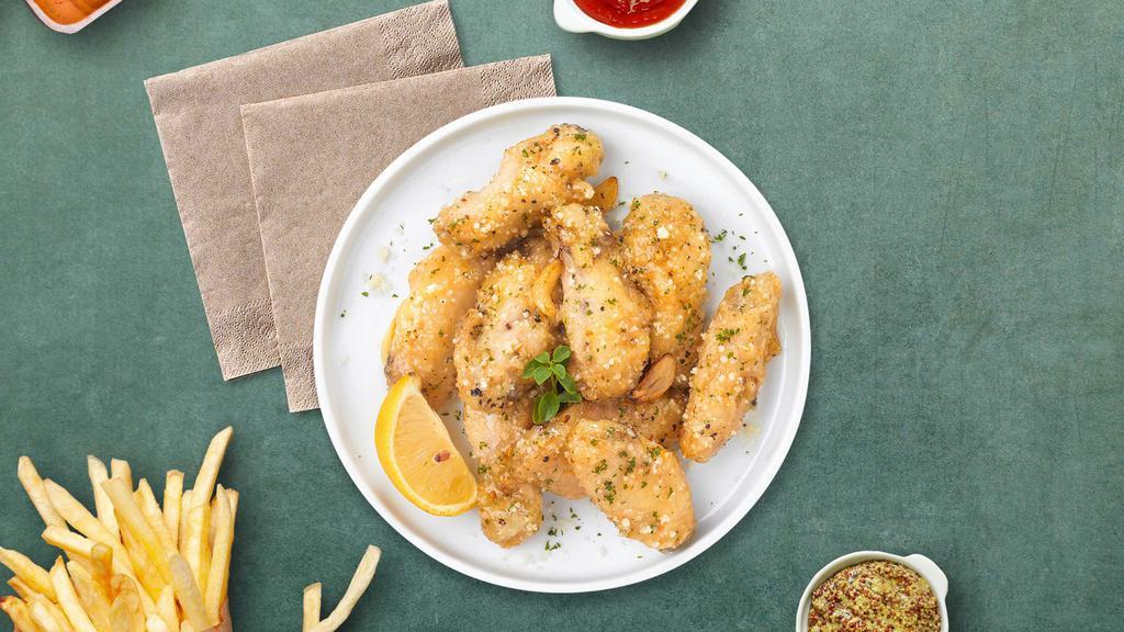 Go Go Garlic Parmesan Wings · Fresh chicken wings breaded, fried until golden brown, and tossed in garlic and parmesan. Served with celery or carrots, and blue cheese or ranch.