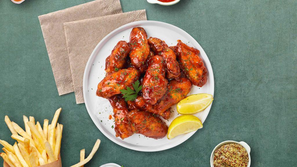 Medium Buffed Buffalo Wings · Fresh chicken wings breaded, fried until golden brown, and tossed in medium buffalo sauce. Served with celery or carrots, and blue cheese or ranch.