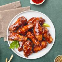 Wing Jerker · Fresh chicken wings breaded, fried until golden brown, and tossed in jerk sauce. Served with...