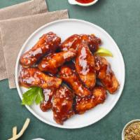 Bbq Queen Wings · Fresh chicken wings breaded, fried until golden brown, and tossed in barbecue sauce. Served ...