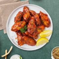 Sweet Sizzling Wings · Fresh chicken wings breaded, fried until golden brown, and tossed in honey and barbecue sauc...
