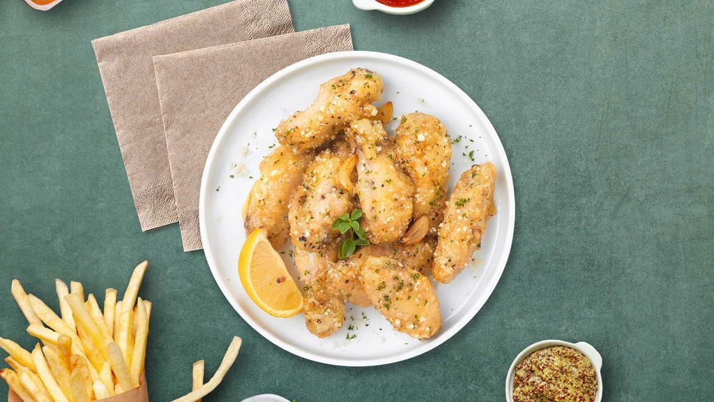 Great Garlic Parmesan Boneless Wings · Fresh boneless chicken wings breaded, fried until golden brown, and tossed in garlic and parmesan. Served with celery or carrots, and blue cheese or ranch.