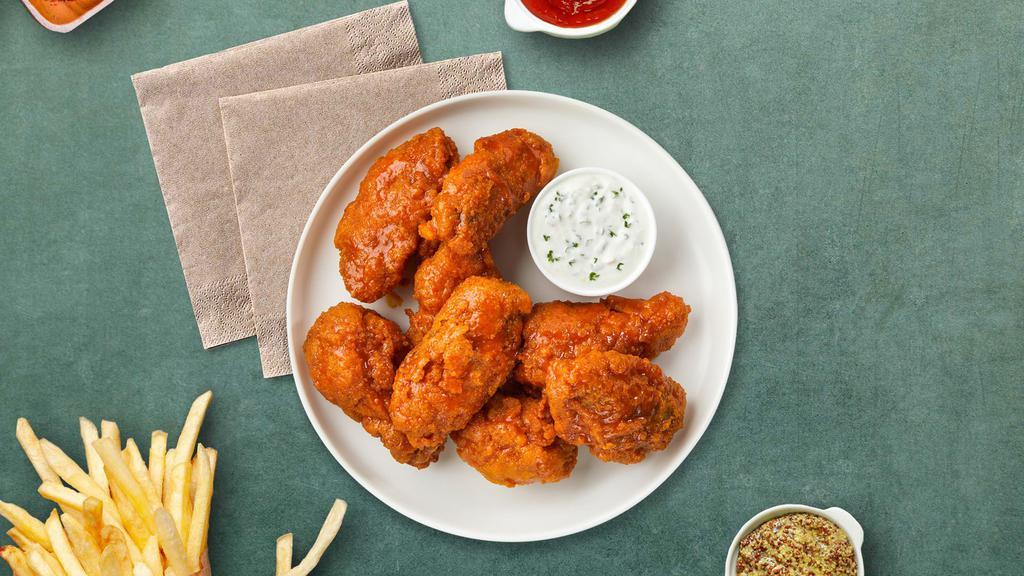 Mango Jango Habanero Boneless Wings · Fresh boneless chicken wings breaded, fried until golden brown, and tossed in mango habanero sauce. Served with celery or carrots, and blue cheese or ranch.