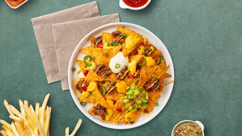 Loaded Nachos · Warm chips topped with salsa, guacamole, sour cream, and cheese.