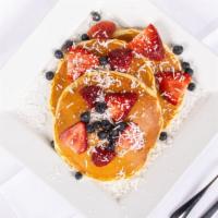 Nyack Pancakes · Topped w/ Fresh Strawberries, Banana & Blueberries