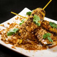 Chicken Satay · Yogurt curry, spicy peanut sauce, cilantro, grilled pineapple, crushed peanuts.