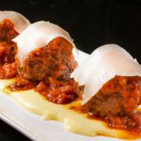 Braised Veal Meatballs · Creamy polenta, tomato sauce, parmigiano.