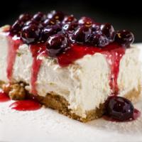 Blueberry & Ricotta Cheesecake · Graham cracker crust, blueberry, and port wine sauce.