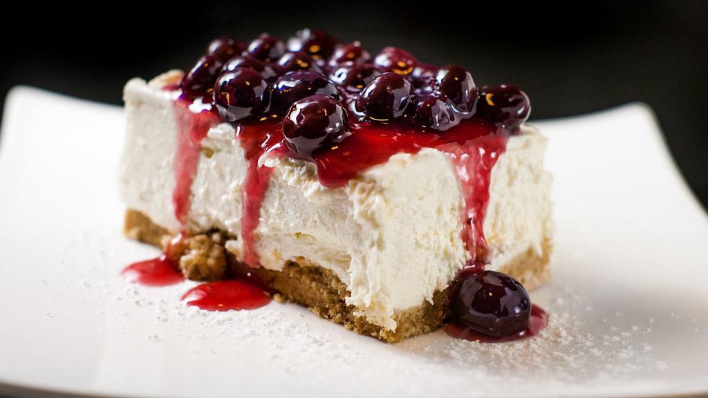 Blueberry & Ricotta Cheesecake · Graham cracker crust, blueberry, and port wine sauce.