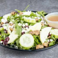 Baby Arugula Salad · Baby arugula, goat cheese, caramelized walnuts, sliced green apples, cranberries and cucumbe...