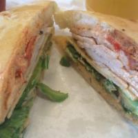 Turkey Club Sandwich · On toasted country white with NY Cheddar, hardwood smoked bacon, tomatoes, fields greens, an...