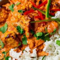 Chicken Tikka Masala · Boneless pieces of chicken breast cooked in tomato and creamy sauces.