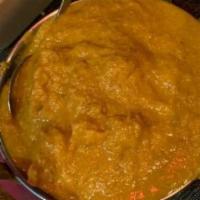 Korma (Mild) · Boneless chicken/ lamb/ goat cooked with saffron creamy almond sauce and pineapple.