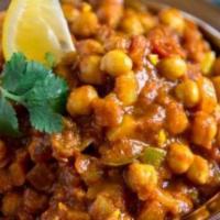 Chana Masala · Chickpeas cooked in tangy sauce and spices.