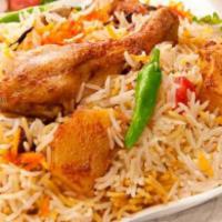 Chicken Biryani · Aromatic basmati rice cooked with marinated chicken, herbs, and spices.