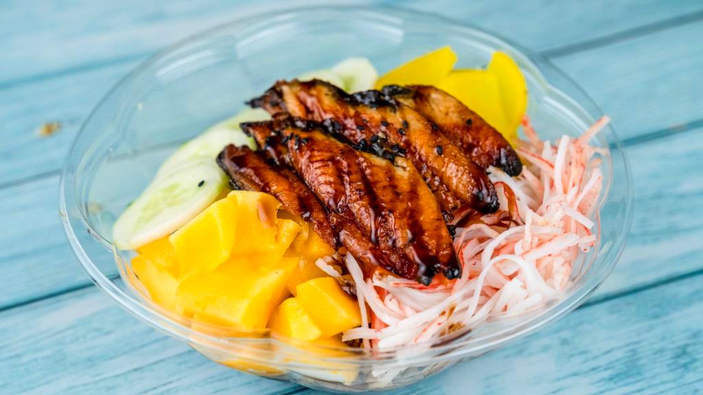 Eel Under The Sea · Grilled Eel, Mango, Onion, Cucumber, Oshinko, Kani and topped with Eel Sauce and Sesame Seed