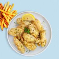 Fuzzy Garlic Parmesan Wings · Fresh chicken wings breaded, fried until golden brown, and tossed in garlic and parmesan. Se...