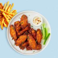 Clucking Wings · Fresh chicken wings breaded and fried until golden brown. Served with a side of ranch or ble...