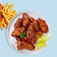 Honey Be My Bbq Wings · Fresh chicken wings breaded, fried until golden brown, and tossed in honey and barbecue sauc...