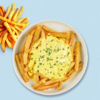 Cheese Chaser Fries · Idaho potato fries cooked until golden brown and garnished with salt and melted cheddar chee...