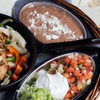 Lunch Fajitas · Grilled beef or chicken fajitas served with three flour tortillas, rice, refried beans and g...