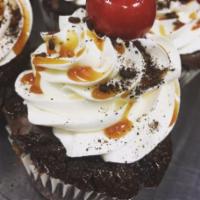 Brownie Sundae Cupcake · Decadent dark chocolate, milk chocolate, and fudge brownies topped with our signature butter...