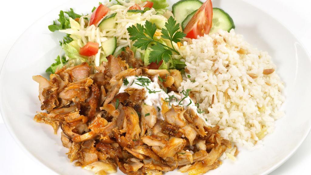 Gyro Over Rice · Homemade juicy gyro meat over rice with, lettuce, tomatoes, our delicious white sauce topped with our hot sauce.