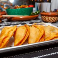 Empanadas · Order of 4 Empanadas. Choice of:  
Chicken Tinga
Beef Picadillo
Roasted Corn, Peppers and Ch...