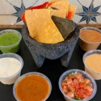 Small Side Of Salsa And Chips · Small side of salsa (4oz) and Tortilla Chips.

Choice of one 4 oz Salsa:
Salsa Verde
Cilantr...