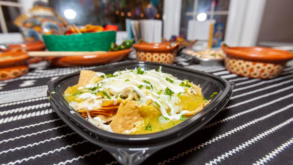 Chilaquiles  · Crispy Tortilla Chips, homemade Enchilada sauce, melted cheese, crema, cilantro and onion.