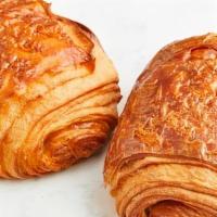 Pain Au Chocolat · Our flaky butter croissant is made with 100% imported French butter and filled with chocolat...