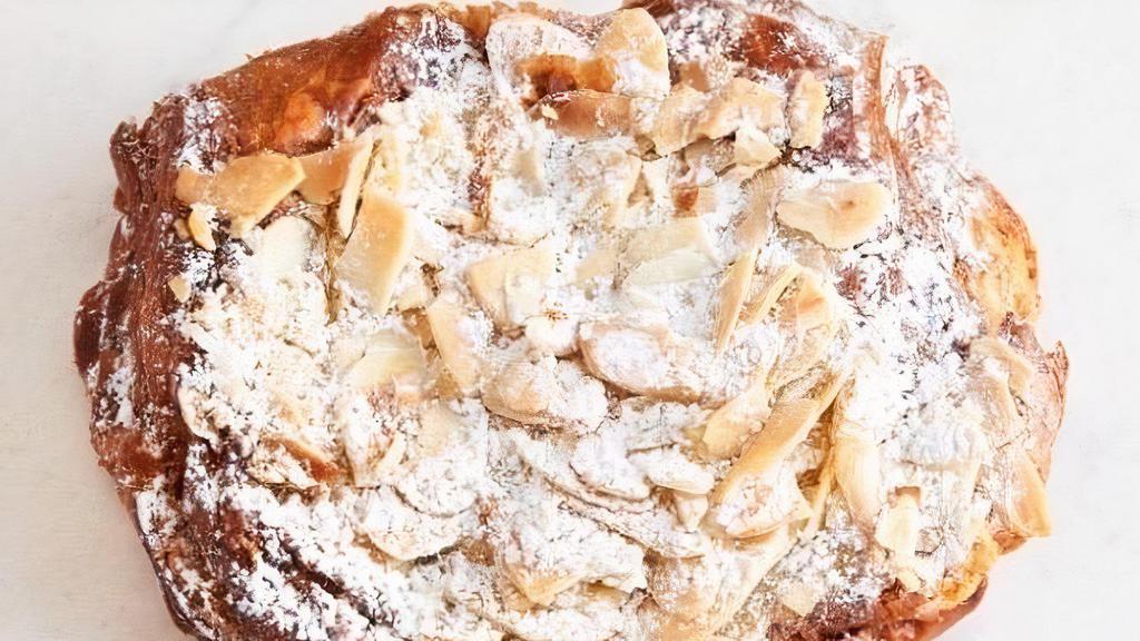 Chocolate Almond Croissant · Our flaky butter croissant is made with 100% imported French butter and filled with chocolate batons and almond cream.
