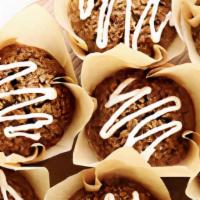 Vegan Carrot Muffin · Lightly spiced carrot cake muffins with a drizzle of icing on top. You won't miss the eggs o...