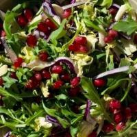 Brussels & Pomegranate Salad · Shaved Brussels Sprouts, Baby arugula, red cabbage, cracked almonds, pomegranate seeds
