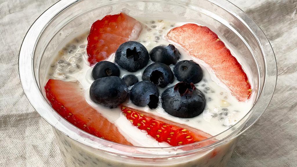 Overnight Oats · Overnight Oatmeal, chia seeds, strawberries, blueberries.