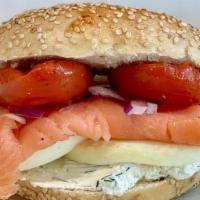 Brooklyn Bridge · Lox, eggs, dill cream cheese and tomato on a sourdough bagel