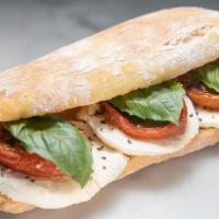 Italian Sandwich · Fresh mozzarella, honey-roasted tomatoes and basil, drizzled with olive oil on Orwashers Cia...