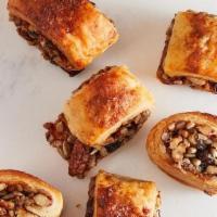 Raspberry Rugelach · Traditional Jewish rolled cookies made with a sweetened cream cheese dough and filled with r...