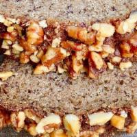Banana Walnut Loaf · Our favorite moist and tender banana bread recipe topped with walnuts